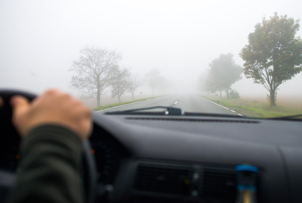 Driving a car through fog
