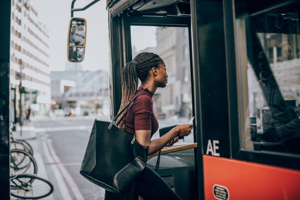 Lady getting on a bus